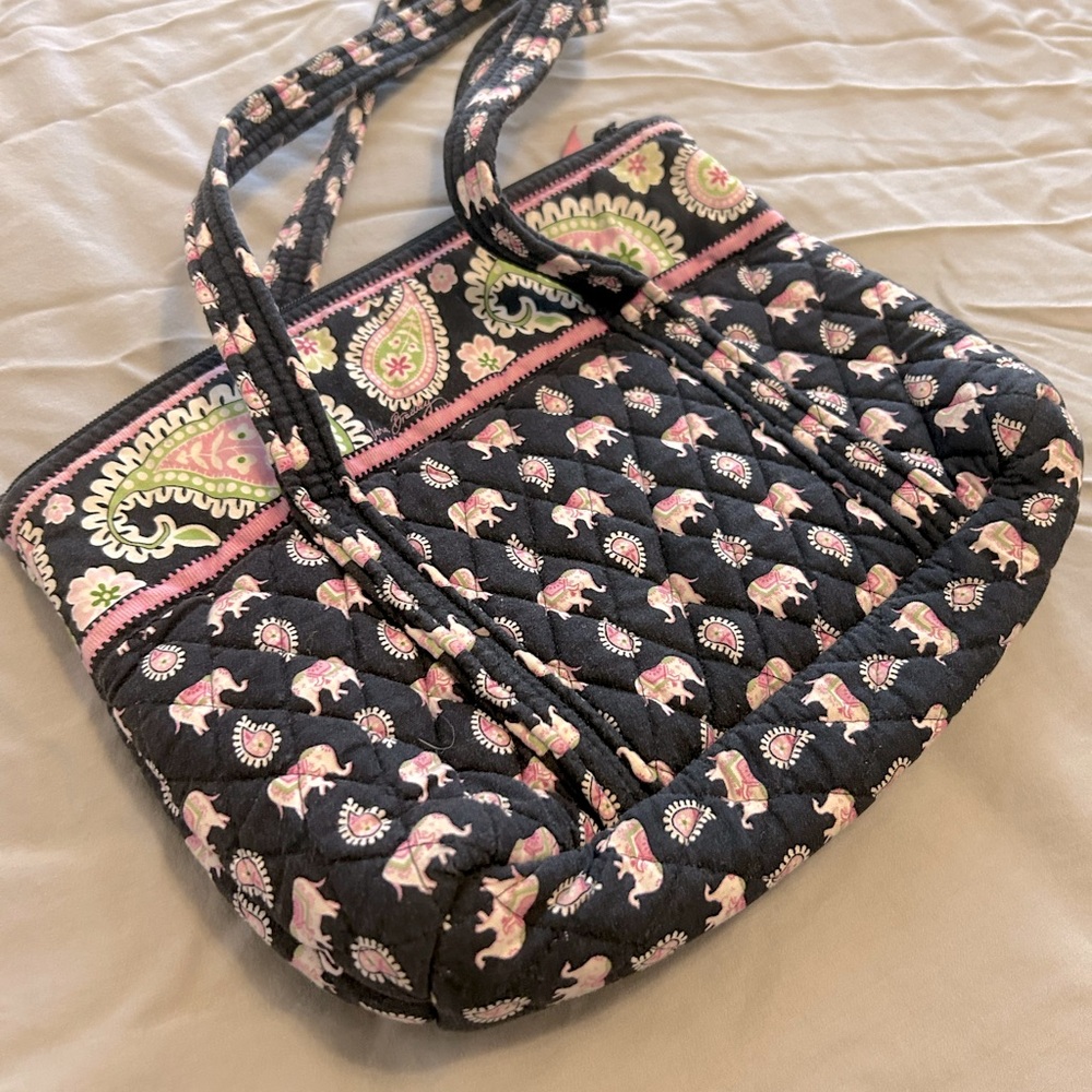 Vera Bradley cloth handbag. Print dark blue pink with paisley trim at top